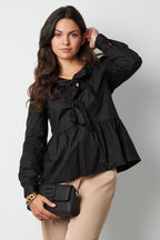 Longsleeve peplum top with bows