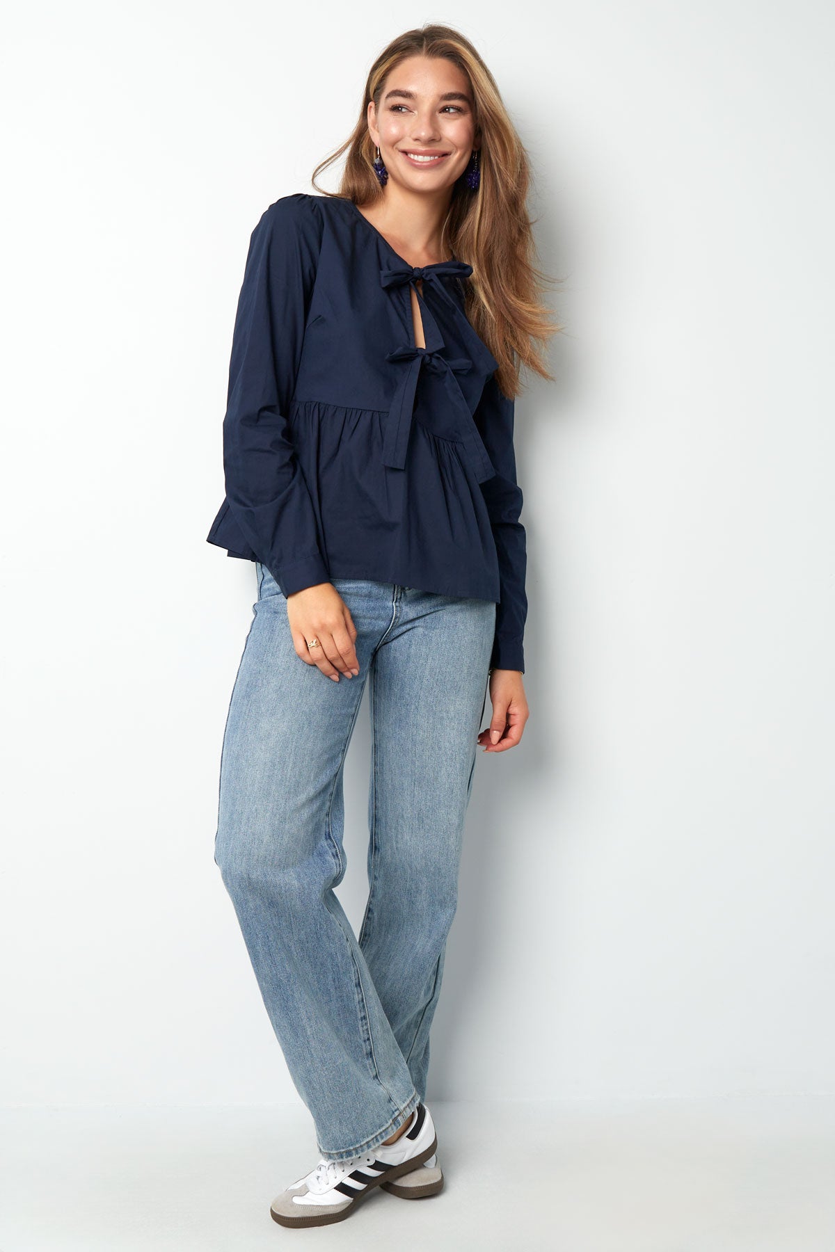 Longsleeve peplum top with bows