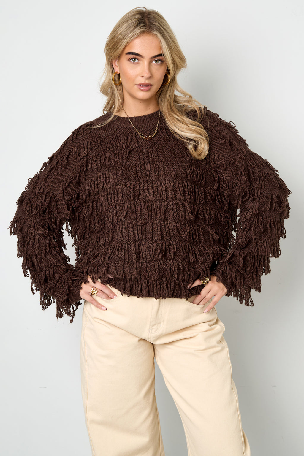 Knitted sweater with fringes